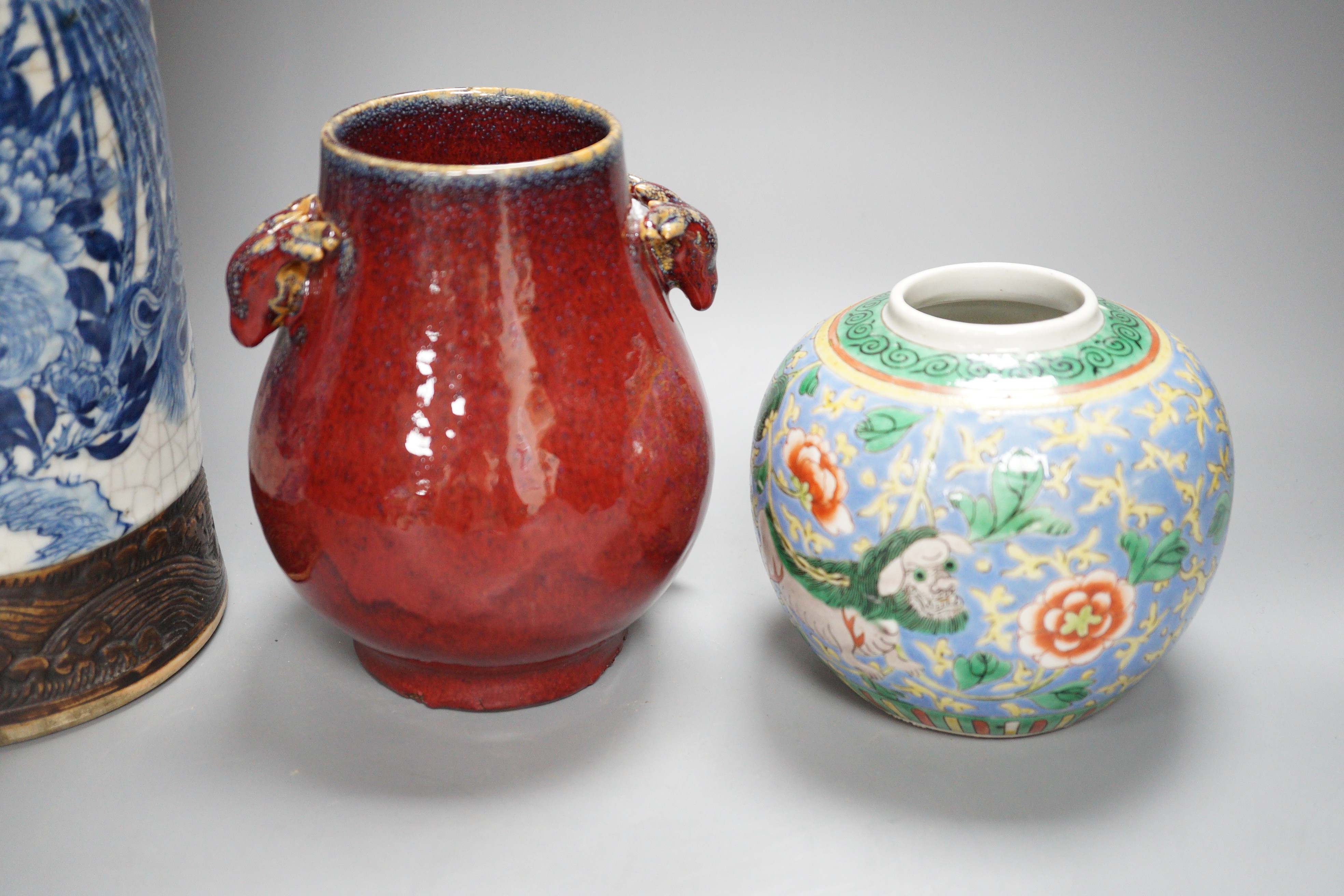 A large Chinese blue and white crackle glaze vase, a sang de boeuf vase and a monochrome jar, tallest 40cm